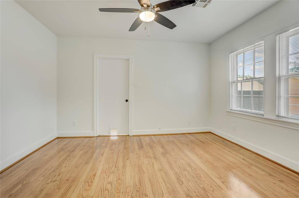 The second bedroom shares a door with the utility room (as well a cute little cat door).  It also has access to the back hallway and back bathroom.