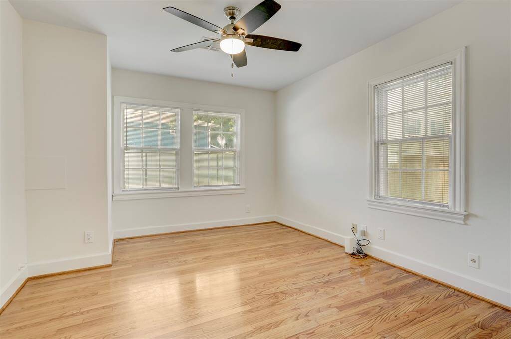 Bedroom number 3 is located off the living room and has shared access to the back hallway and back bathroom.