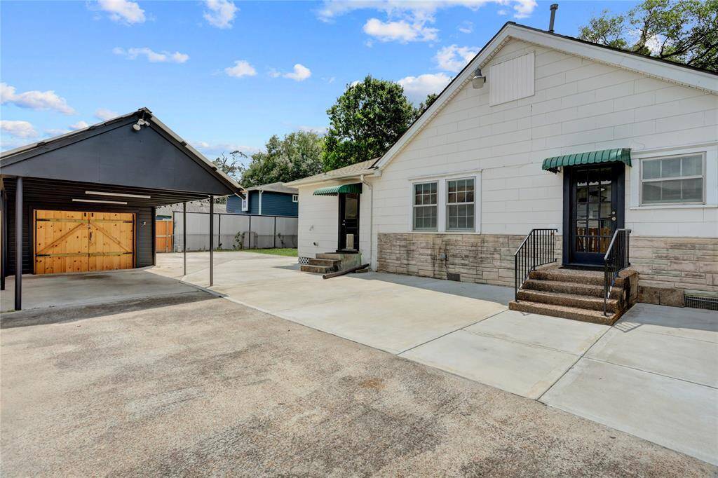 The homeowers expanded this patio to create excellent parking as well as entertainment space.