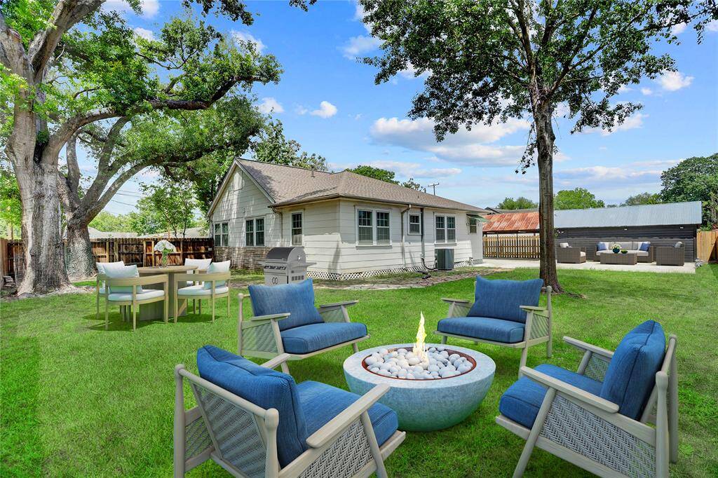So many ways to enjoy the great outdoors in the privacy of your own home.  Here, the yard has been virtually staged to showcase multiple seating areas.