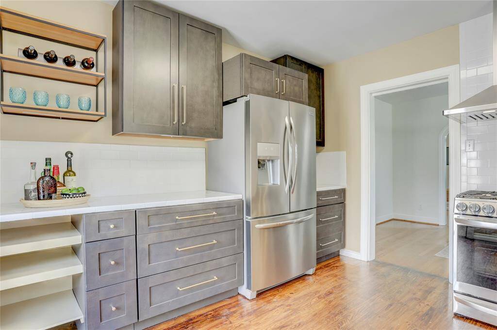 New cabinets, new counters, new tile backsplashes, new lighting and new appliances make this kitchen shine.
