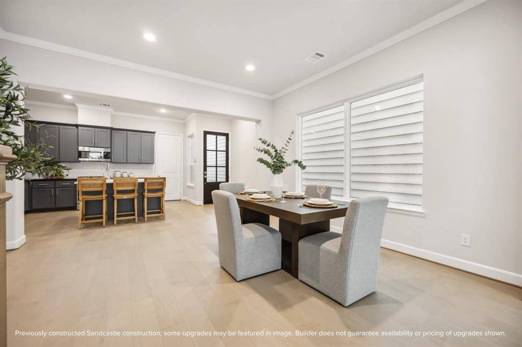 Dine in style in an open, flowing space designed for laughter, conversation, and connection around a large table.