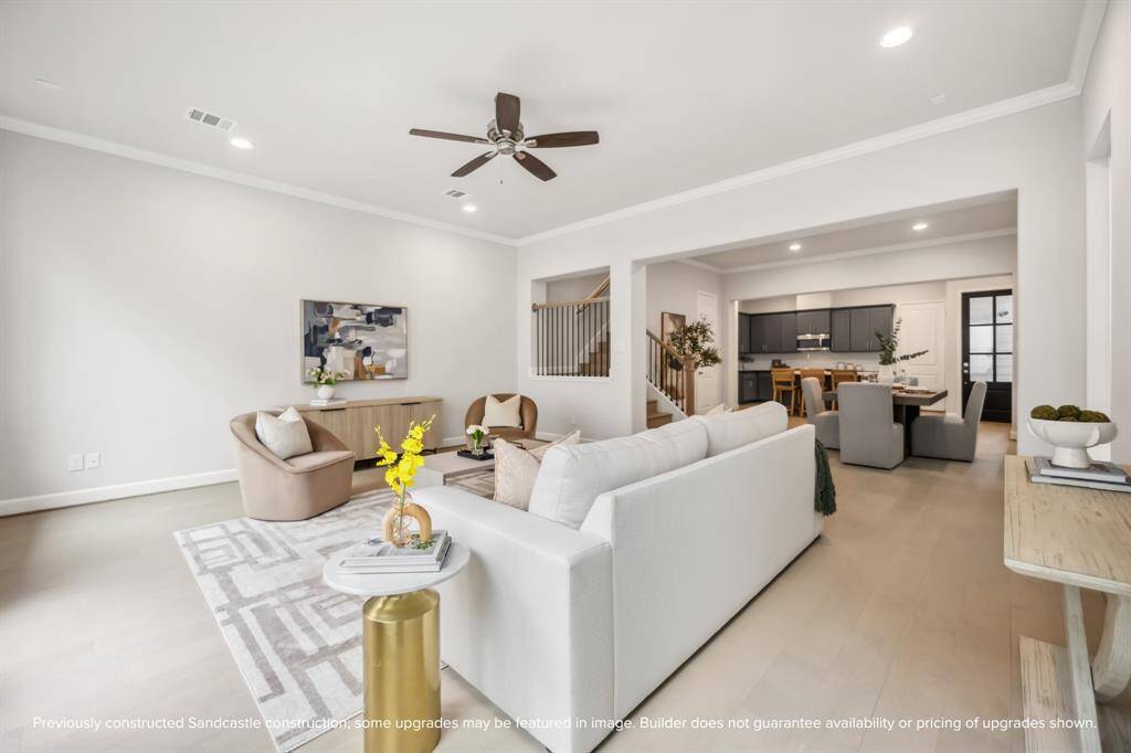 At the heart of the home, this vast living room offers endless possibilities for relaxation and entertaining.