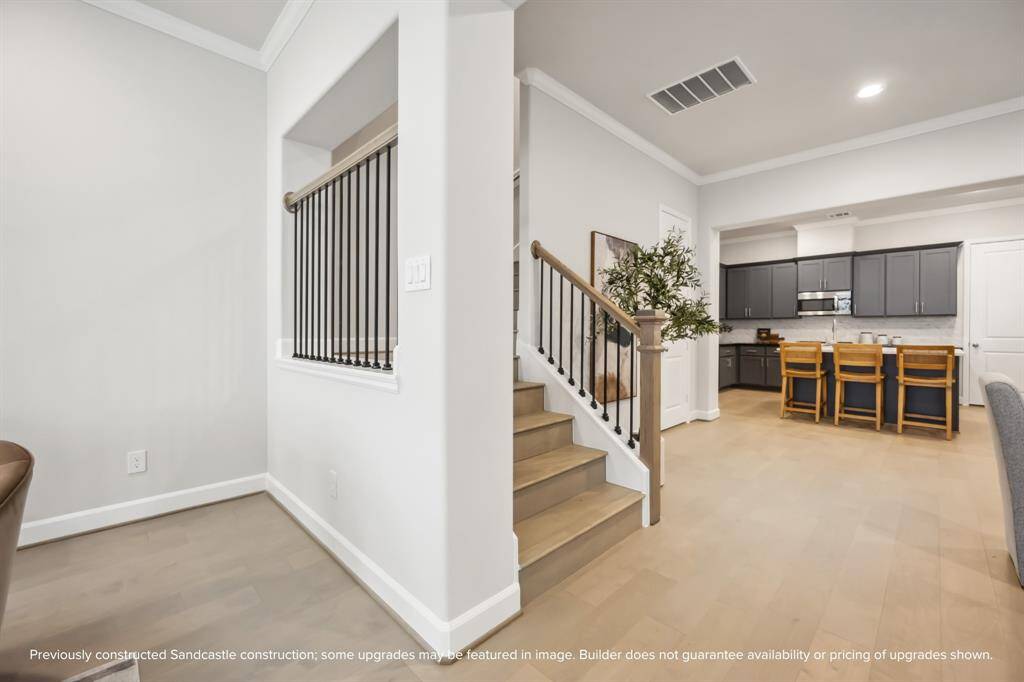 Thoughtfully Designed. The iron stair railing adds a touch of sophistication while complementing the modern aesthetic as you head up to the generous second floor.