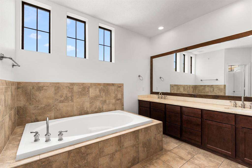Primary bathroom, separate shower/tub and dual vanities.