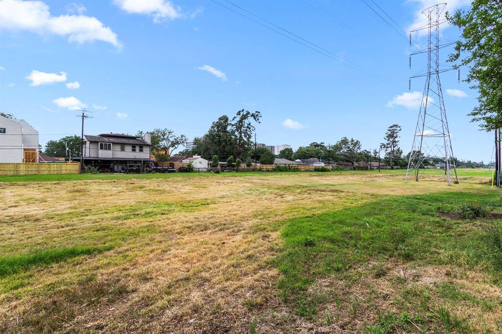 Easement beyond yard with private gate entrance.