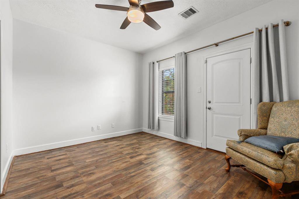 First floor bedroom. Door opens to back patio.