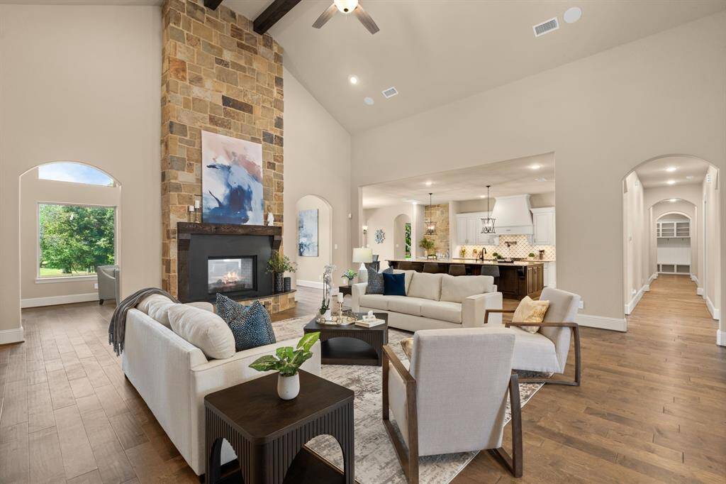 Designed for effortless living, this open and airy family room flows seamlessly into the chef’s island kitchen, casual dining area, and sunroom, creating an ideal layout for both everyday comfort and stylish entertaining. Ceiling speakers provide immersive sound throughout, while the thoughtful design encourages easy, natural movement between each beautifully connected space.