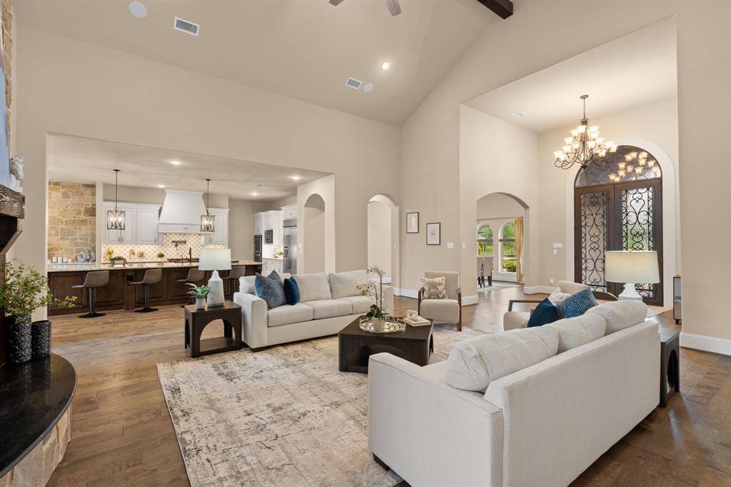 Imagine the sounds of laughter and chatter as you create unforgettable moments in this exceptional home, thoughtfully designed for both grand entertaining and everyday comfort. Host lavish dinner parties in the formal dining room beneath a rotunda ceiling and glittering chandelier, then relax in the open-concept family room that flows effortlessly into the chef’s island kitchen and casual dining area. Every detail works together to create a welcoming, elegant space you’ll be proud to call home.