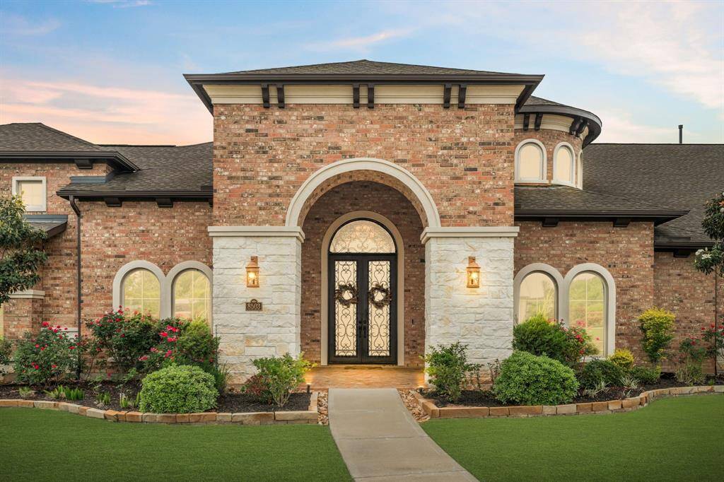Be greeted with a warm welcome every time you approach this home with an impressive entry, where oversized glass and wrought iron doors create a grand first impression. The stunning design and inviting surroundings set the tone for the luxury and comfort that await inside.