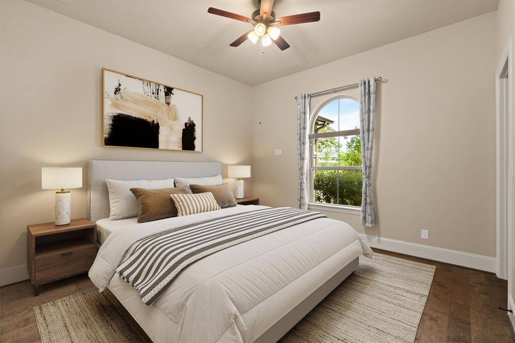With three spacious guest suites, you’ll always have room for company. This inviting suite boasts rich engineered wood flooring, a large walk-in closet, and ensuite access to a private bathroom, providing comfort and privacy for your guests. Photo is virtually staged.
