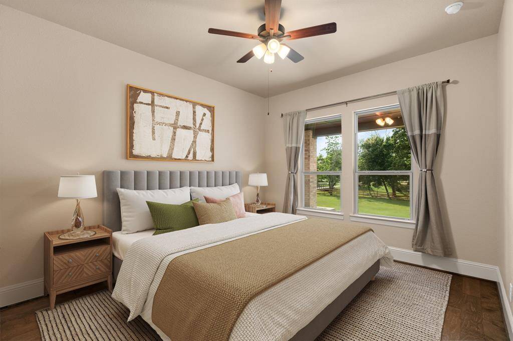 Your family and guests will rest comfortably in this spacious guest suite, providing a peaceful retreat with ample room for furniture and personal touches, soft neutral finishes, a large walk-in closet, and ensuite access to a private bathroom for added comfort. Photo is virtually staged.