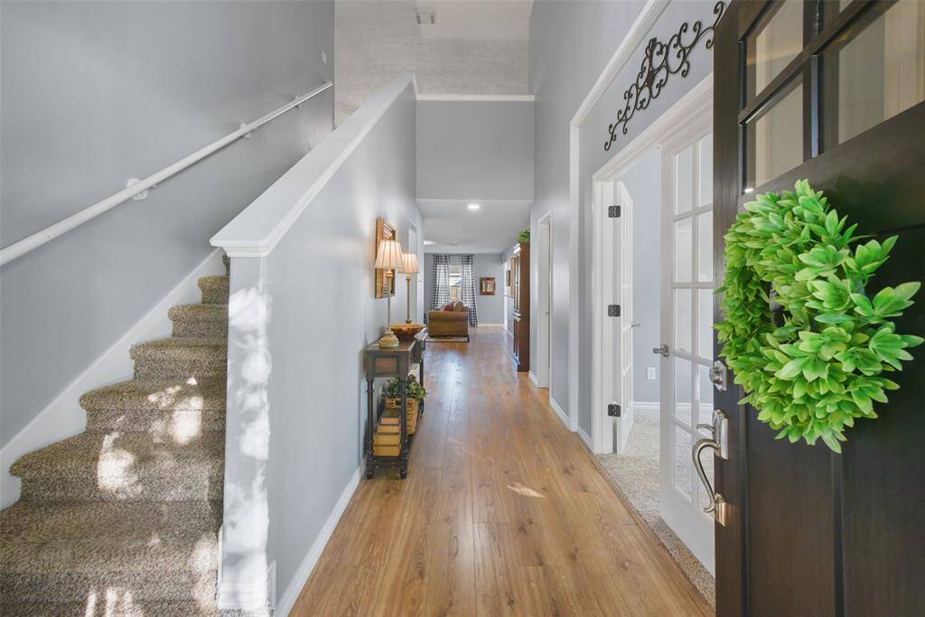 Updated flooring invites you into the entry!
