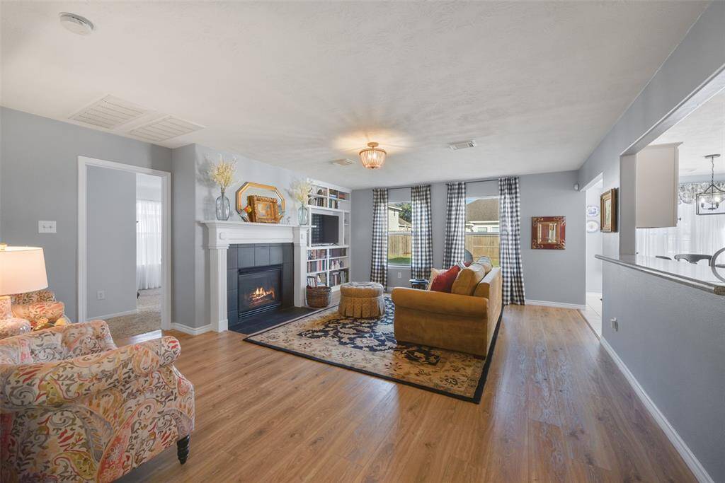 Large comfortable family room equipped with a gas log fireplace.