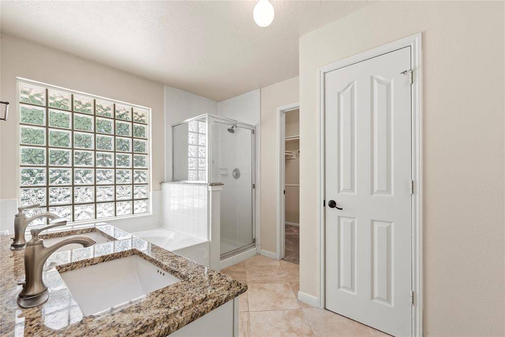 Primary Bathroom has Double Sinks, Soaking tub with separate shower and a walk-in closet.**8615 Westcove Circle, Houston, TX 77064**