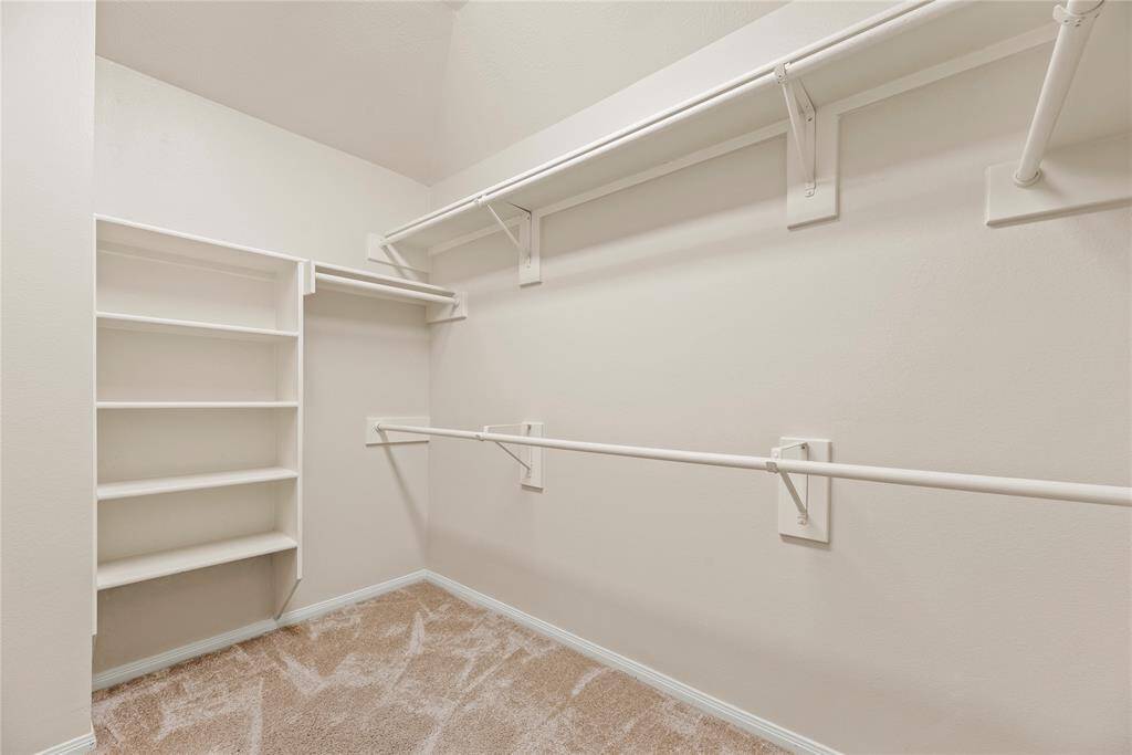 Primary Bedrooms walk-in closet w built in shelving. **8615 Westcove Circle, Houston, TX 77064**