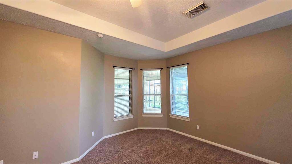 Adorable reading nook overlooks the sunroom and has a view of the lake