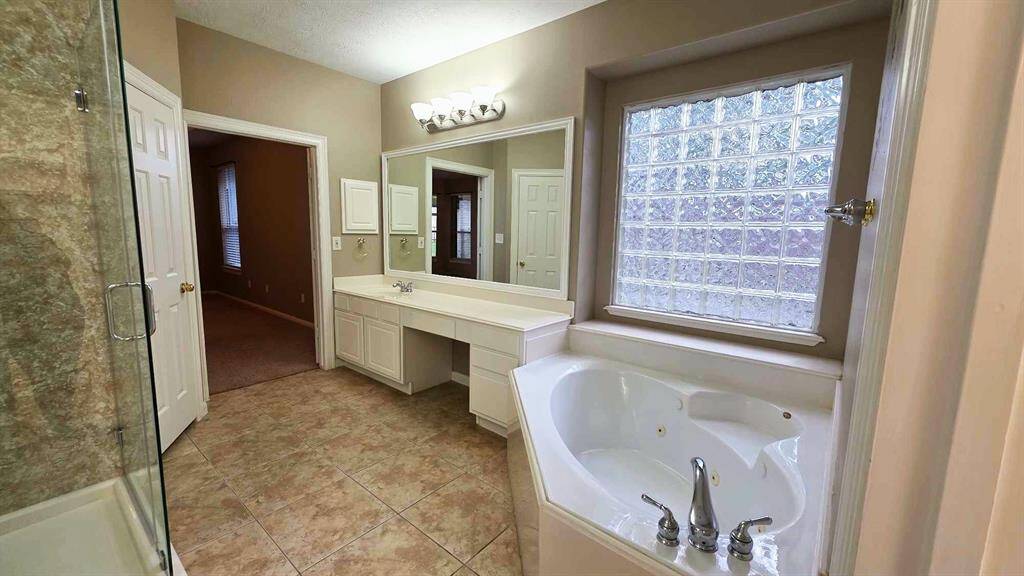 Jetted garden tub is waiting to melt away the day