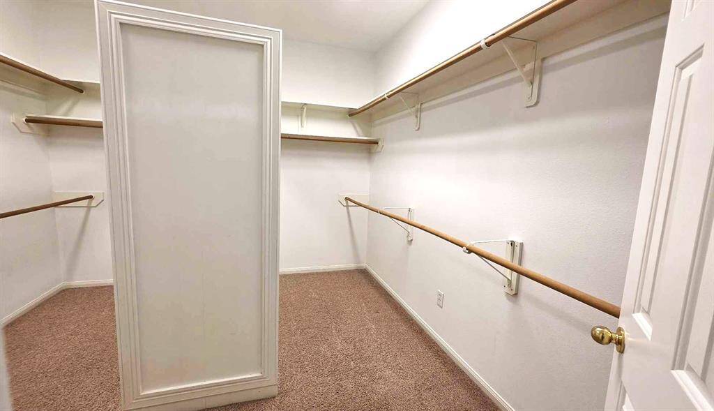 The owner's walk in closet is over 11 x 11'
