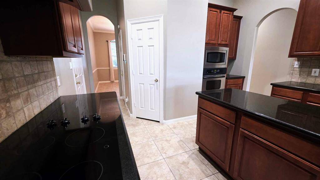 A look back towards the dining room, pantry and door to the garage