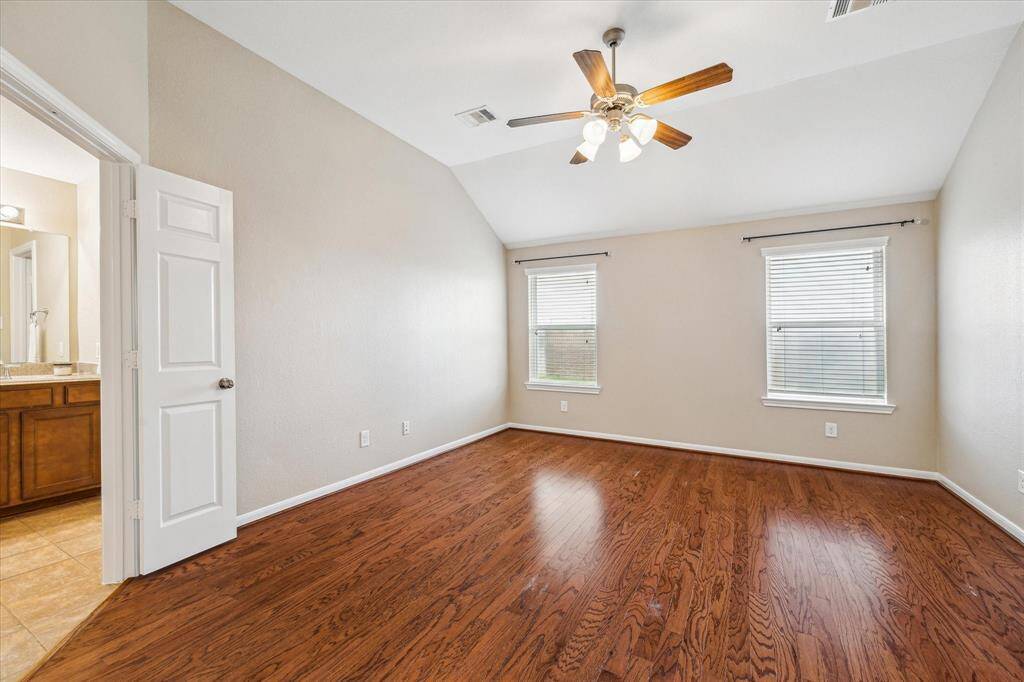 TPeaceful primary bedroom retreat with en-suite bathroom.