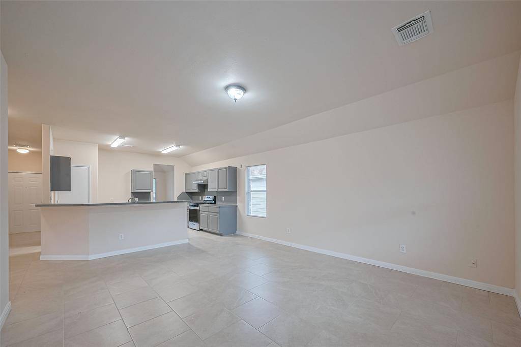 Another view of the living room area, showing open concept Kitchen/Living Area space