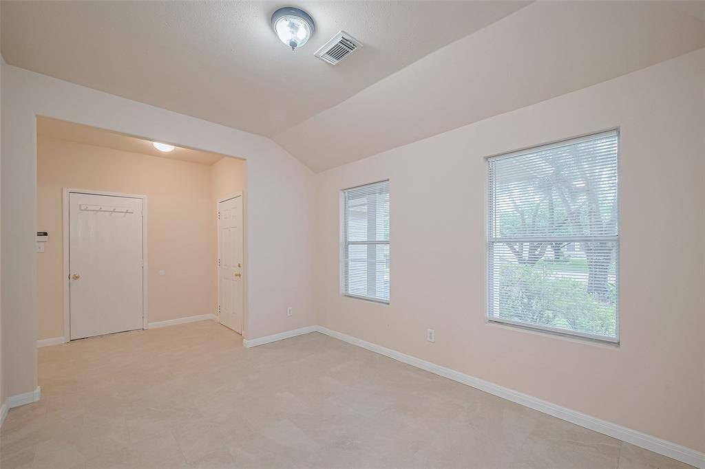 Another view of the formal dining room showing front door entrance