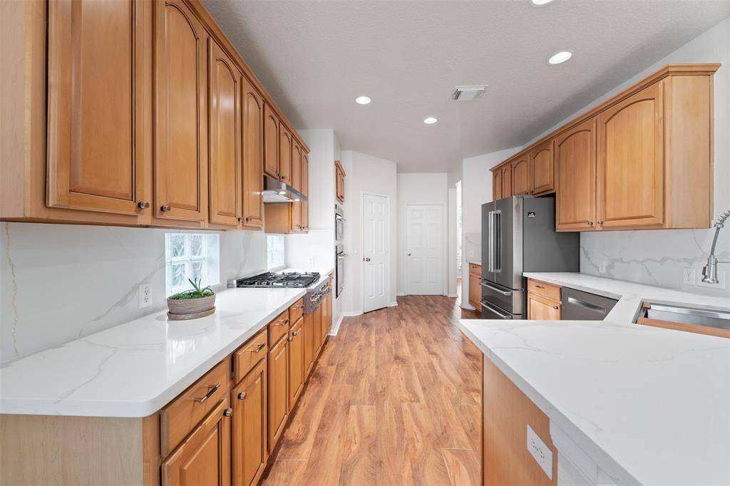 Kitchen with updated cabinets, quartz counters and ZLine SS appliances