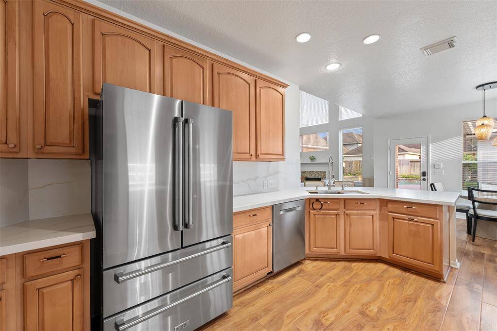 Kitchen with updated cabinets, quartz counters and ZLine SS appliances