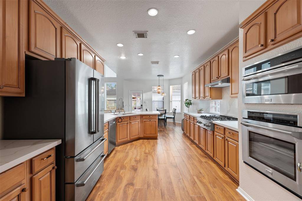 Kitchen with updated cabinets, quartz counters and ZLine SS appliances