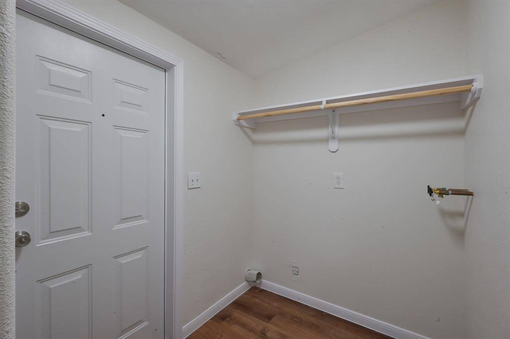 Laundry Room located inside the house. Back door on the left.