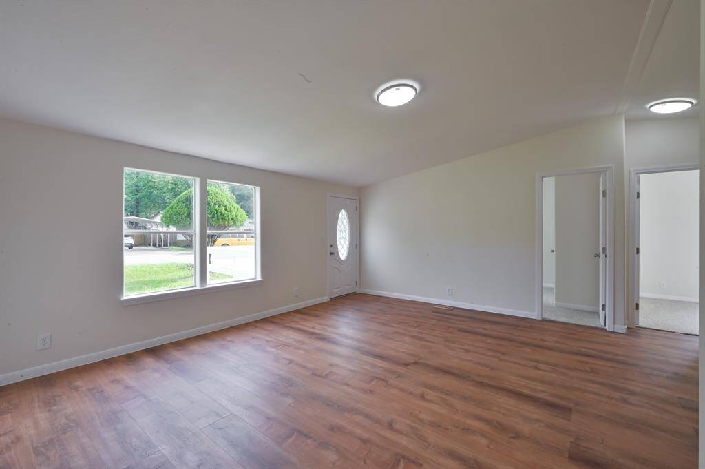 Living Room. Facing the front door. Bedroom 1 on the right.