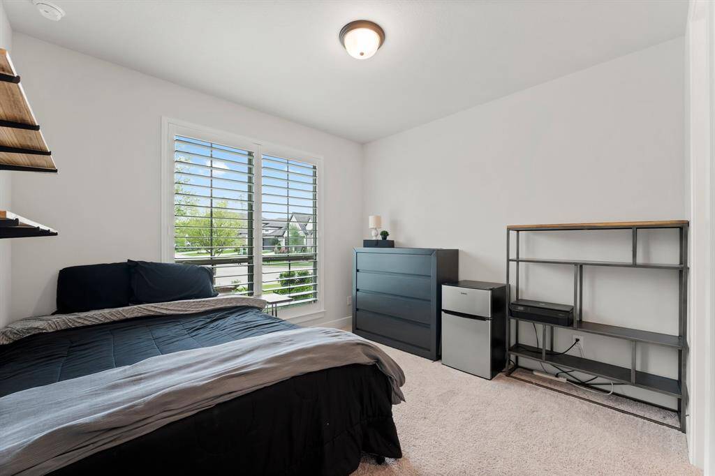 First floor secondary bedroom offers great options for multi-generational living, a guest room, or additional study.