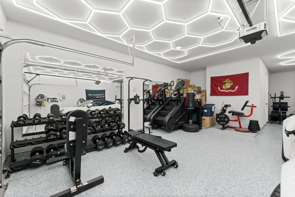 Three car tandem garage with epoxy flooring and tankless water heater!