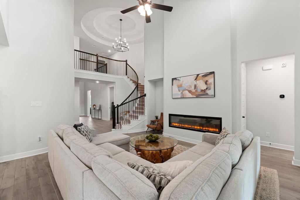 Glamorous 2 story fireplace is perfect for chilly nights.