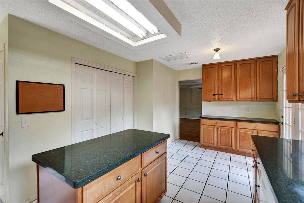 An island in the center of the kitchen allows more space when cooking or hosting a group!