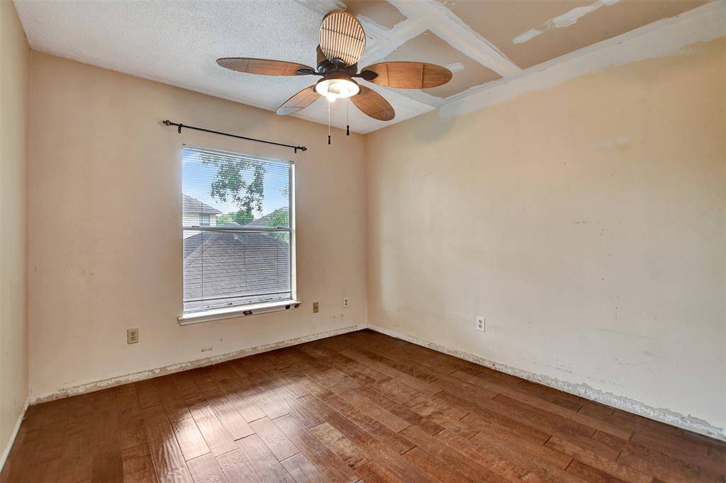 Spacious secondary bedroom #2 with views of the backyard.