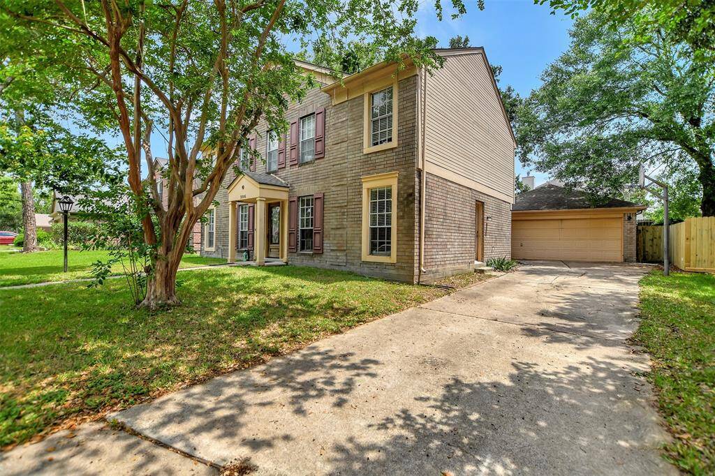 Are you tired of your cars sitting out in the street? They won't need to anymore with this extra-long driveway that leads to a 2 car detached garage