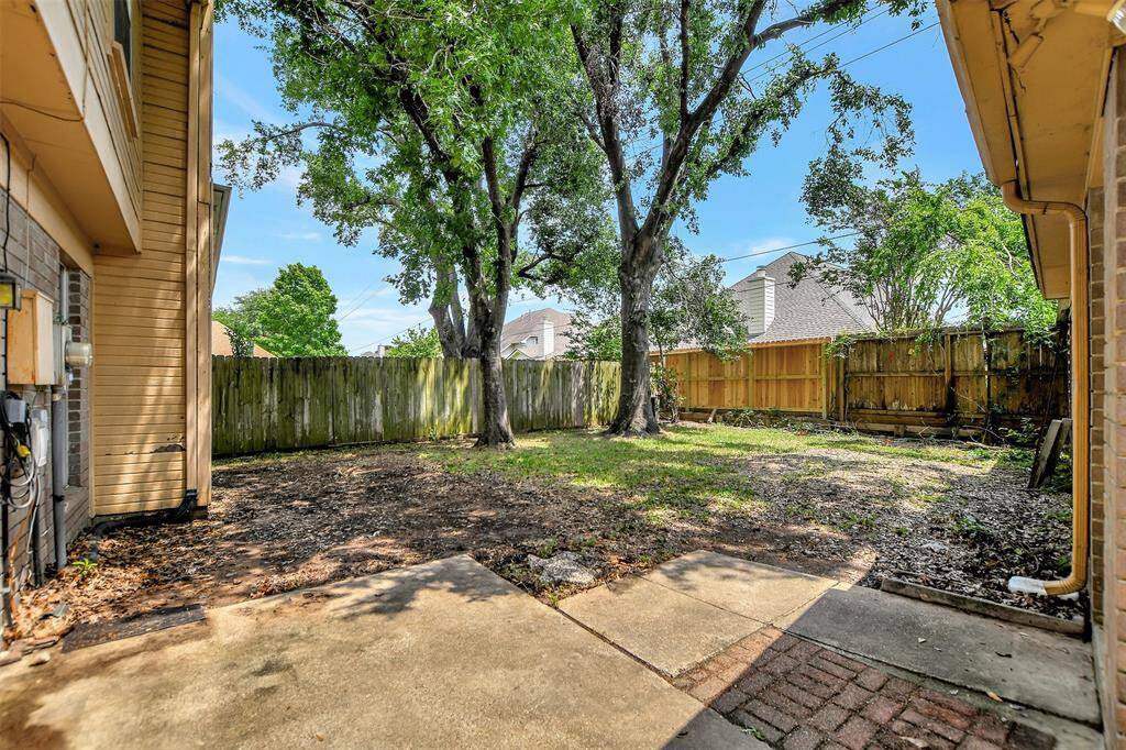 The backyard has a patio and grass area to be used as you need!