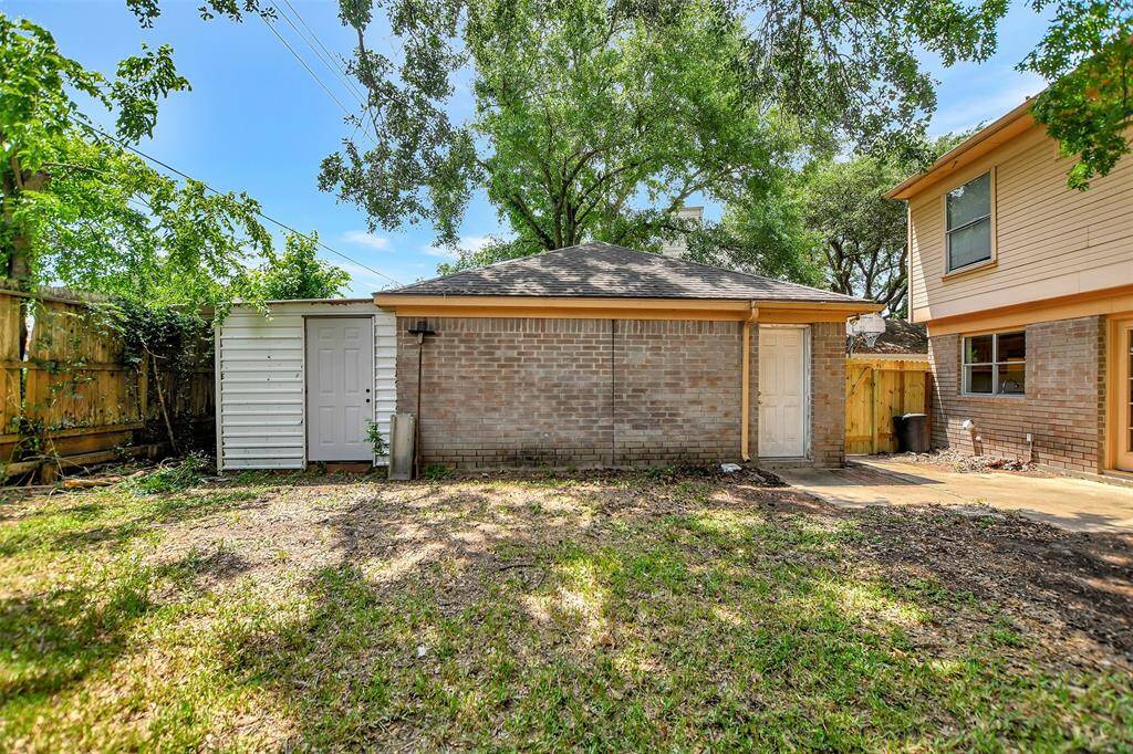 Another view of the backyard, which has a newly replaced fence and gate!