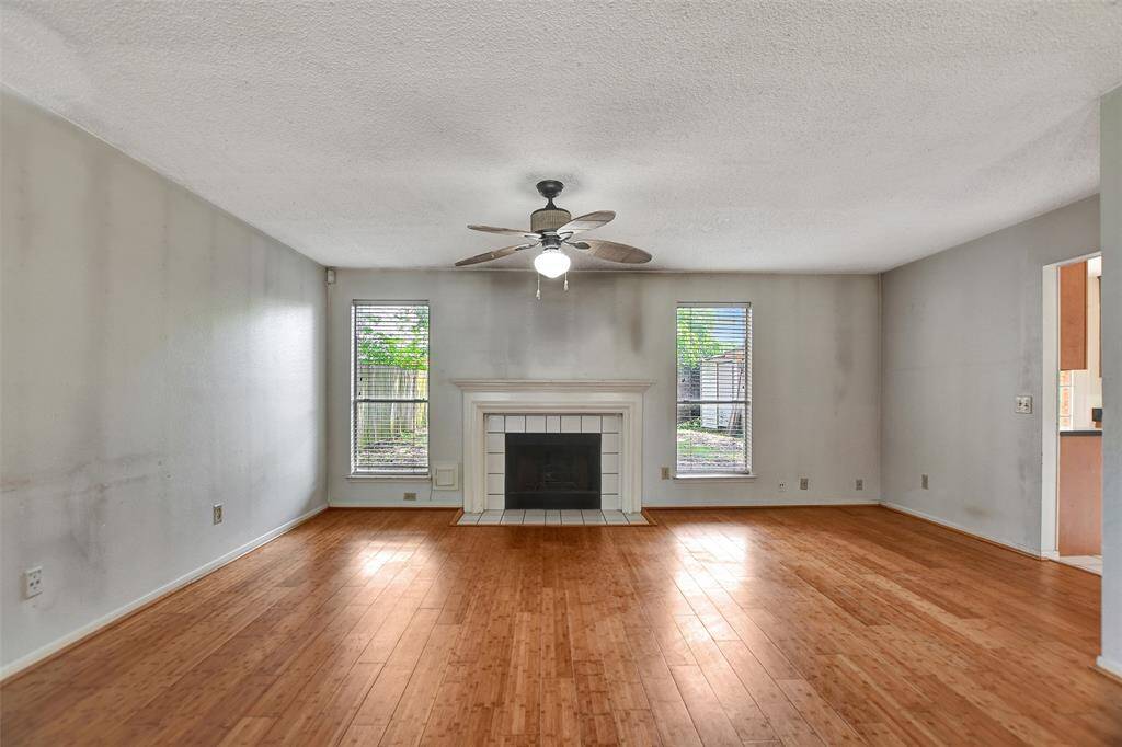 This house has a gas log fireplace and bamboo flooring in the living room.