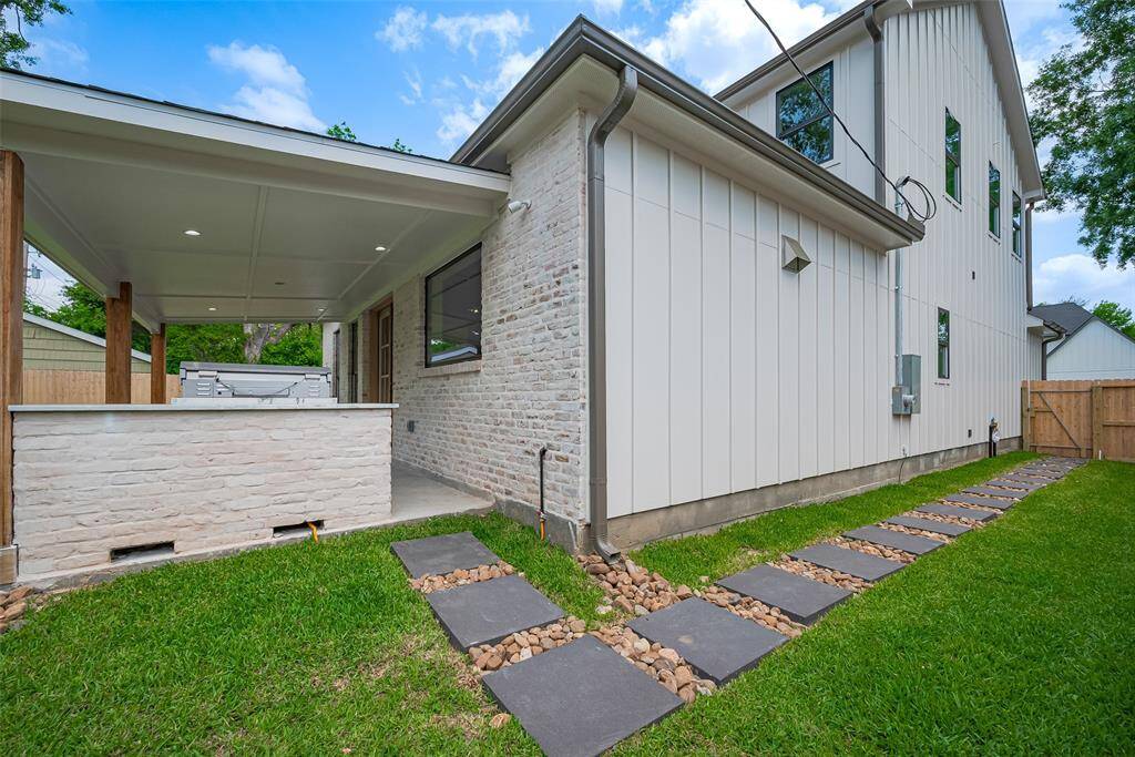 Home features gutters around home and stone/rock walkway