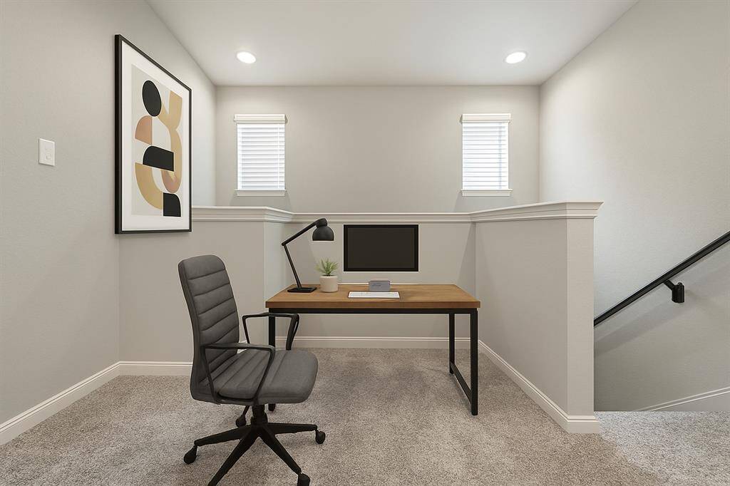 As you walk upstairs, the landing on the second floor is perfect for a home office or reading space (virtually staged).