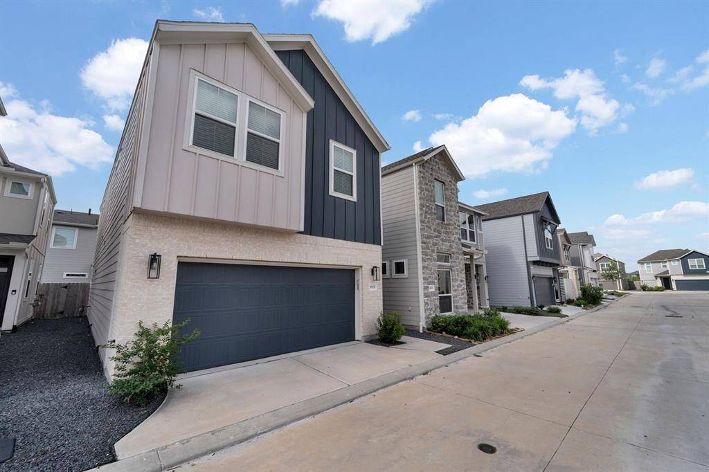 A two car garage provides plenty of space for cars and extra storage.