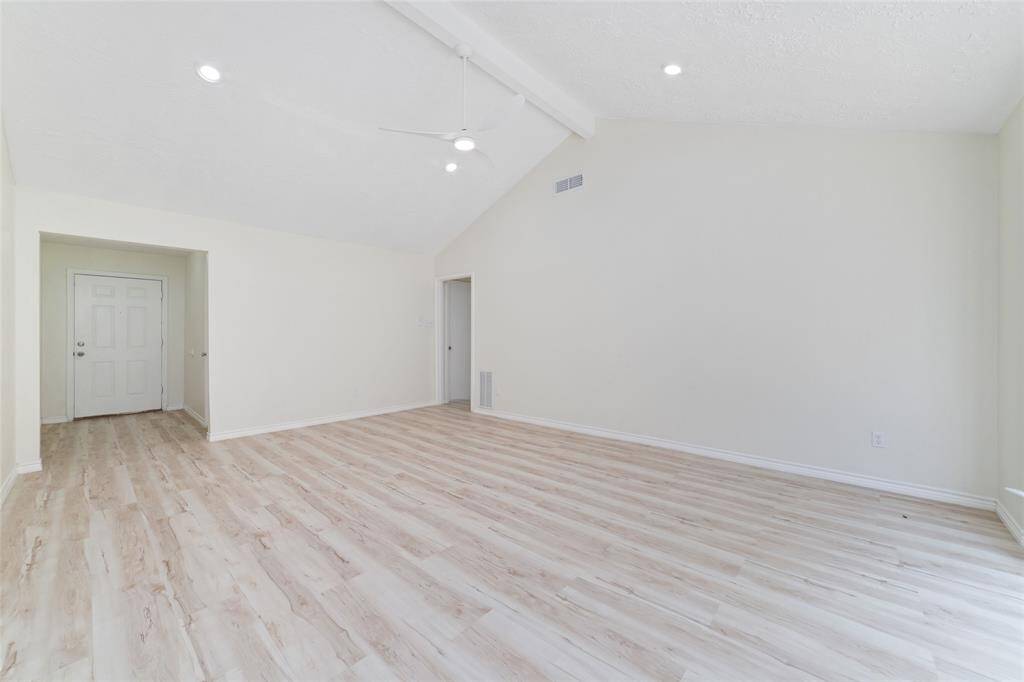 Living room with vaulted ceilings and natural sunlight!