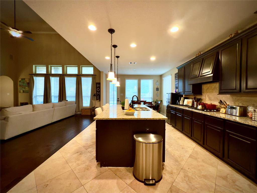 Discover your dream home at 10314 Hatcher Drive. This stunning residence features elegant brick and stone exteriors, a spacious two-car garage, and lush landscaping. Ideal for modern living, this property offers both comfort and style. Don’t miss this exceptional opportunity!
