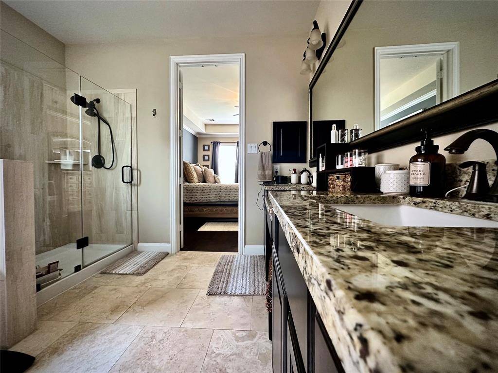 Discover your dream home at 10314 Hatcher Drive. This stunning residence features elegant brick and stone exteriors, a spacious two-car garage, and lush landscaping. Ideal for modern living, this property offers both comfort and style. Don’t miss this exceptional opportunity!