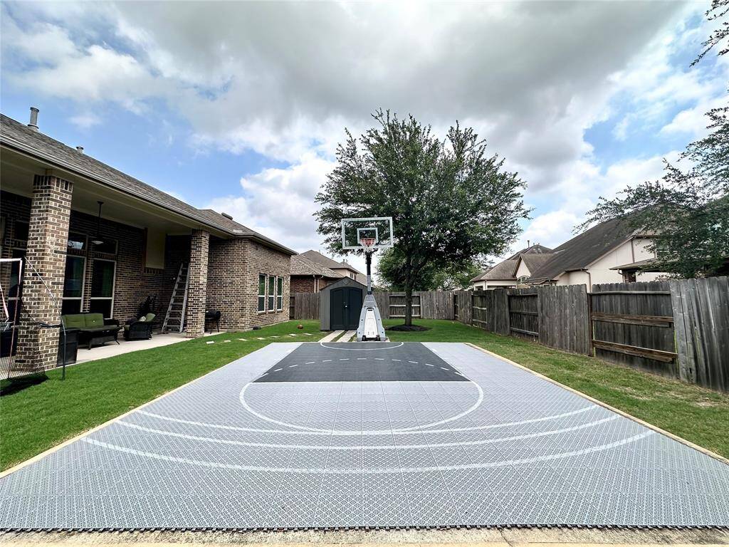 Discover your dream home at 10314 Hatcher Drive. This stunning residence features elegant brick and stone exteriors, a spacious two-car garage, and lush landscaping. Ideal for modern living, this property offers both comfort and style. Don’t miss this exceptional opportunity!