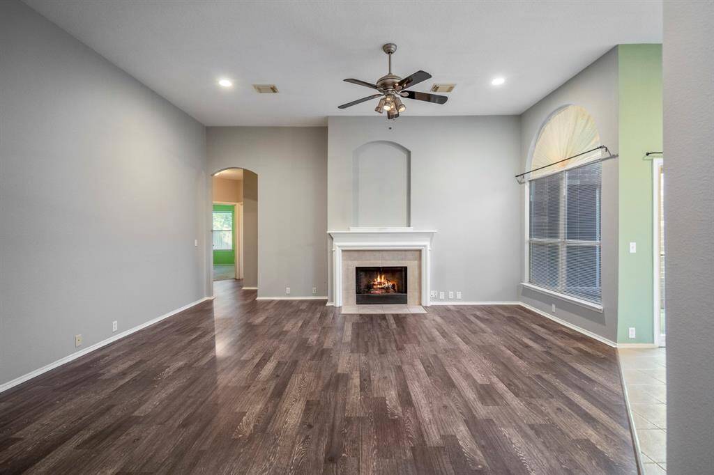 The living room is also spacious, accented by a gas fireplace.
