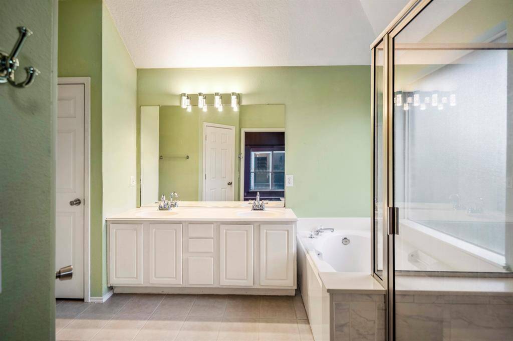 The primary bathroom...dual sinks, garden tub, and separate shower.